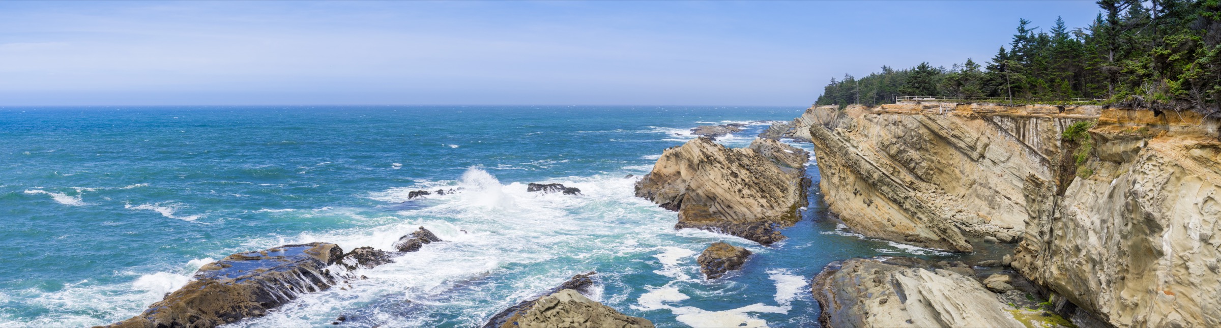 Waves breaking along a rugged rocky coast