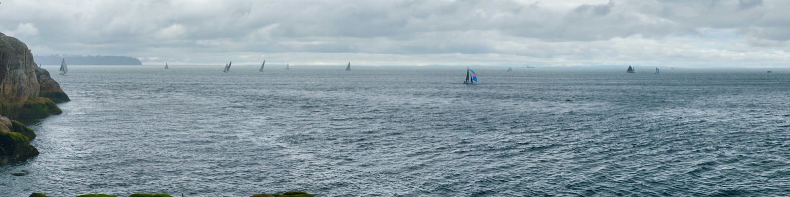 Sailboats finding their courses across open water